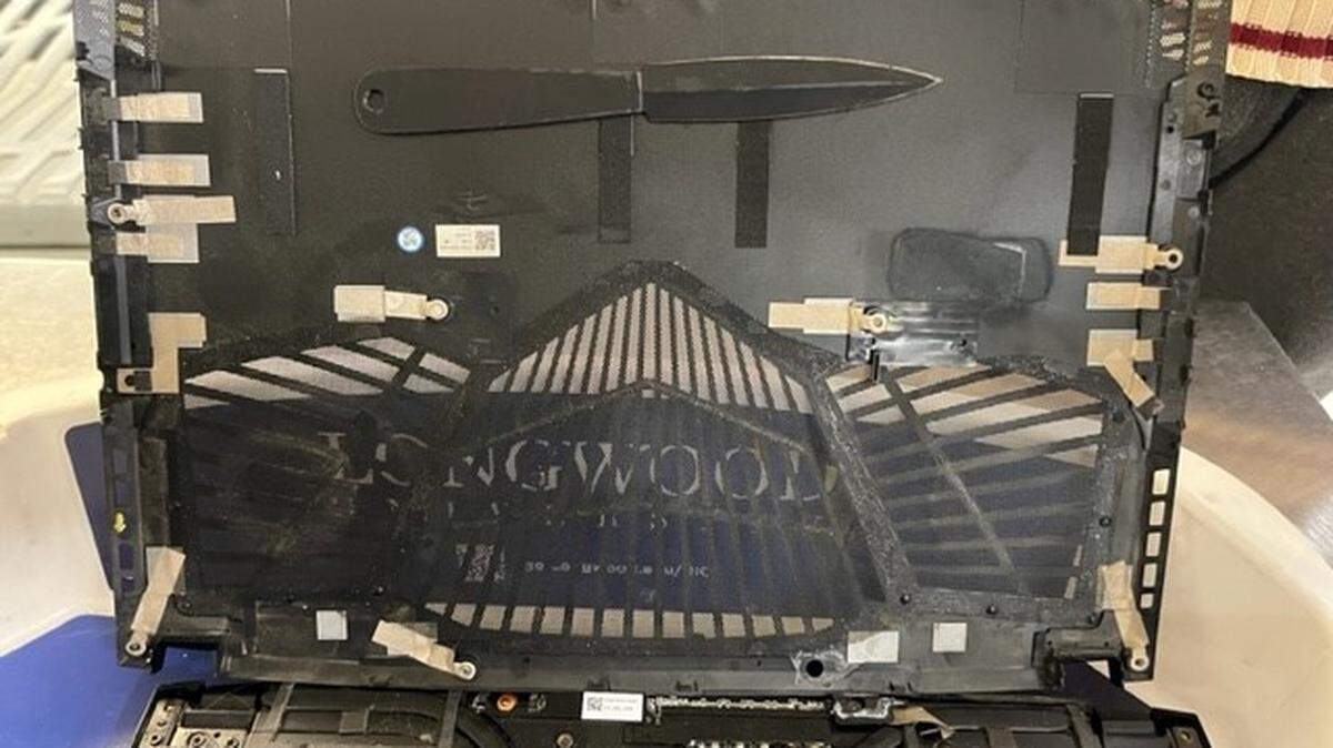 The weapon was “artfully concealed inside the guts of the computer,” officials said.