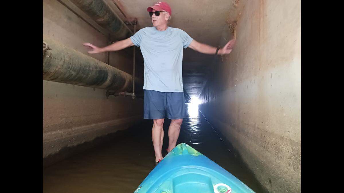 “The water is raging in from Lake Davidson to Lake Norman,” Lake Davidson resident Pat Jenkins quipped as he stood in motionless, three-inch deep water in the tunnel that connects the lakes in Davidson NC Sunday, July 23, 2023.