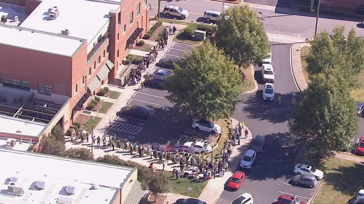 This image from The Charlotte Observer’s news partner WSOC-TV shows voters waiting in Cabarrus County on the first day of early voting for the 2024 election.