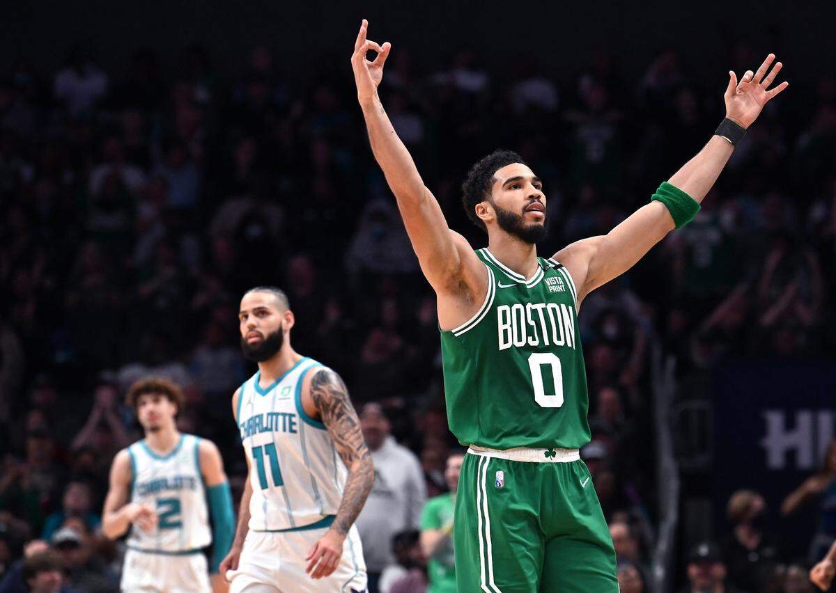Boston Celtics forward Jayson Tatum turns and celebrates a basket to the cheers of the fans during second-half action against the Charlotte Hornets at Spectrum Center in Charlotte, NC on Wednesday, March 9, 2022. The Celtics defeated the Hornets 115-101. Tatum led all scorers with 44 points.