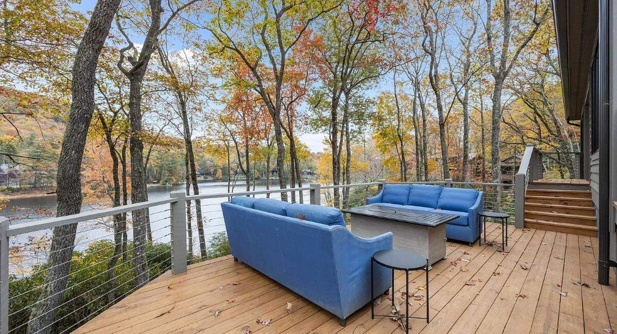 A deck looks out to Lake Cardinal.