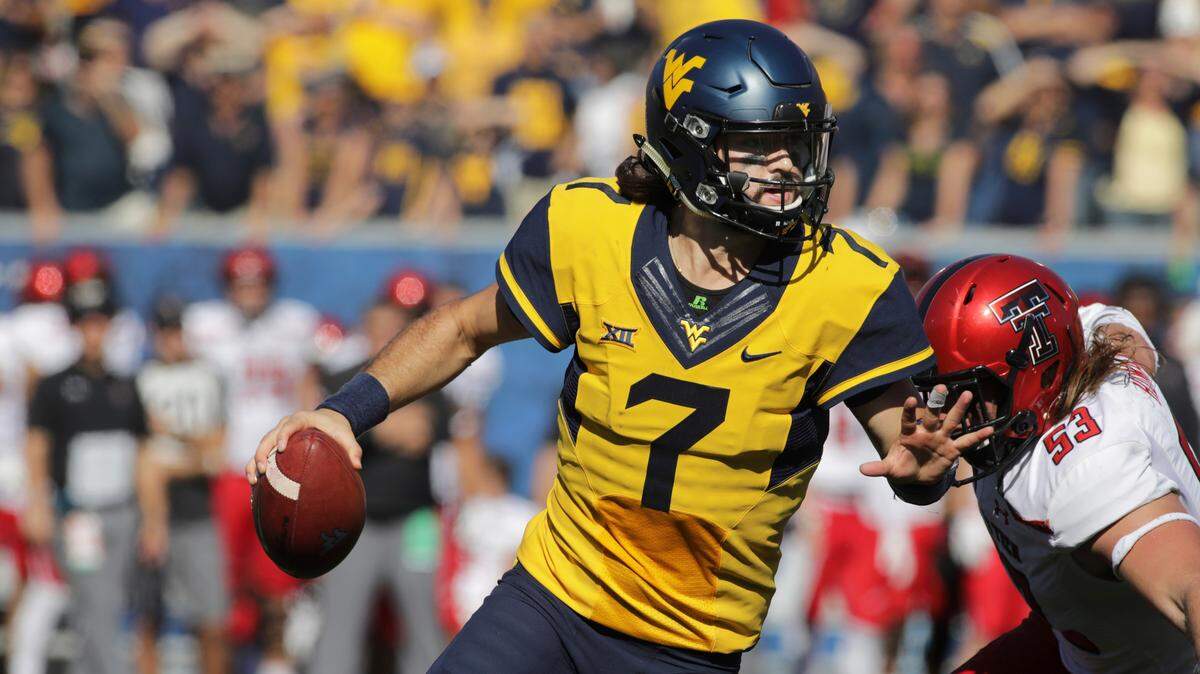 West Virginia quarterback Will Grier (7), who grew up in Davidson, has a homecoming game in Saturday’s match-up with Tennessee at Bank of America Stadium.