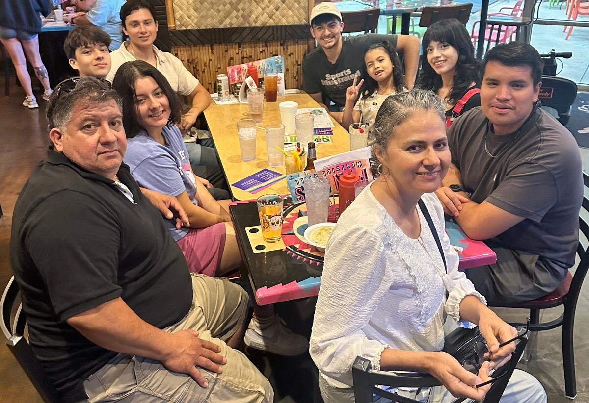 The Palomeras in El Chapala before the storm, with Juanita Ramirez in the foreground and Saul Palomera to the left.