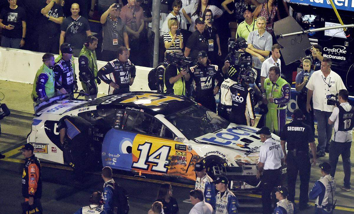 NASCAR drivers Ryan Newman and Clint Bowyer threw punches at each other following a late-race confrontation in the All-Star Race.