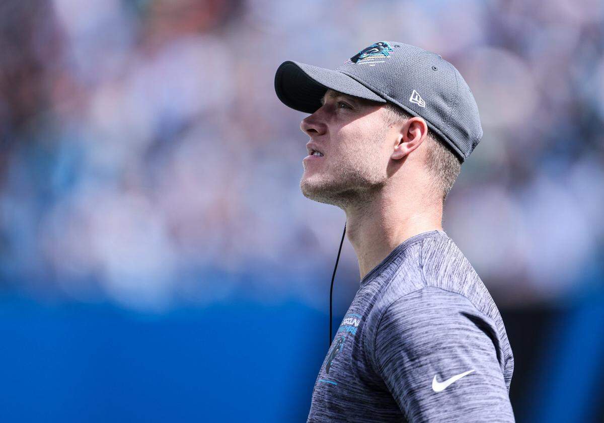 Carolina Panthers Christian McCaffrey stands on the sidelines during the game against the Philadelphia Eagles at the Bank of America Stadium in Charlotte, N.C., on Sunday, October 10, 2021.