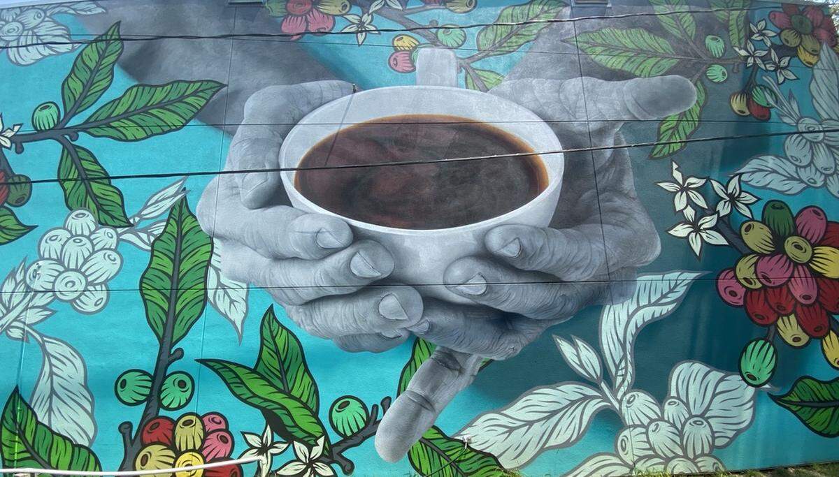 Sip beer and wine and admire art at The Giddy Goat Coffee Roasters, which just unveiled a new space. Mural by Darion Fleming, known as Da.Flamingo.