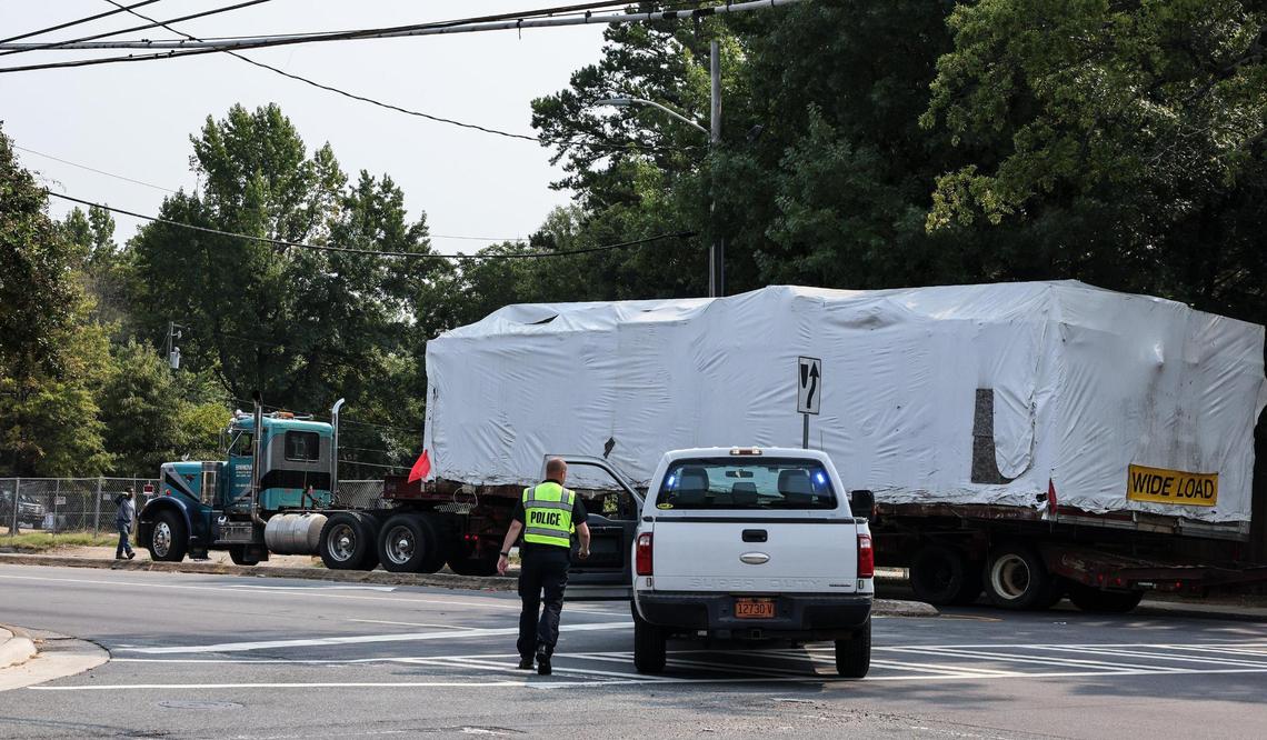 The 42,000-pound stainless steel Mattie’s Diner building is moved by police escort Monday morning to its new location at 3100 The Plaza in Charlotte.
