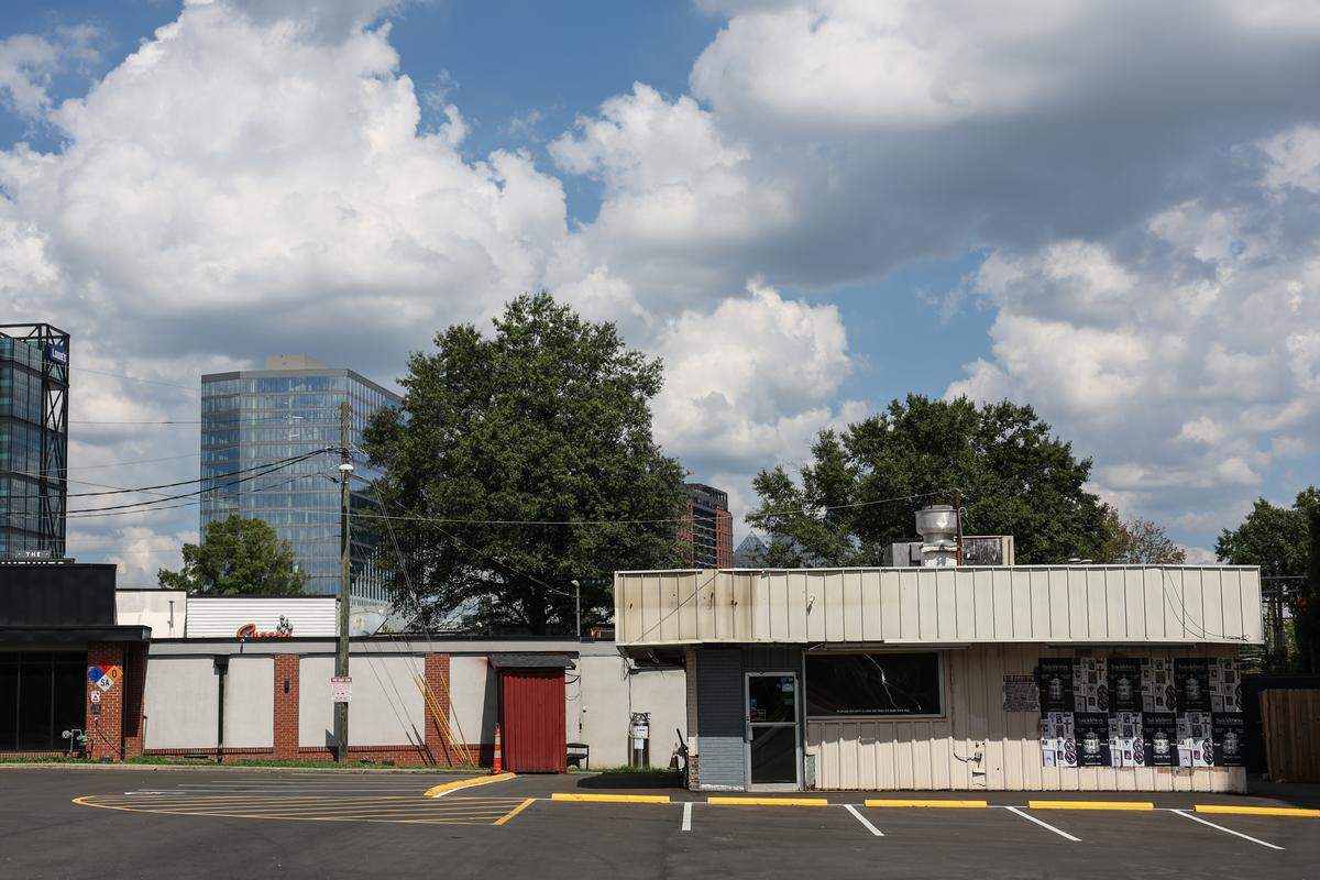 Mr. K’s, a former ice cream shop and diner in South End, sits abandoned  at South Boulevard and Cleveland Avenue in Charlotte. Behind it are gleaming new towers in South End.