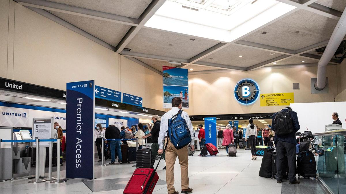 Travelers make their way through Charlotte Douglas International Airport on Tuesday, November 16, 2021 in Charlotte, NC.