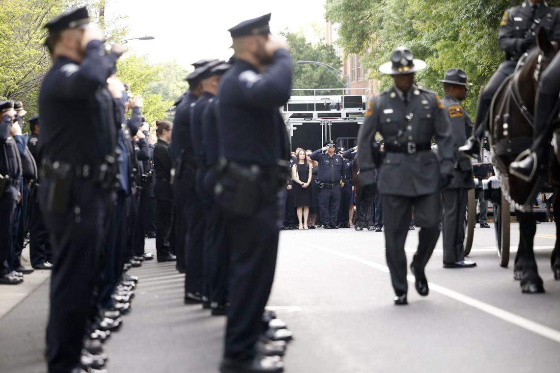 Law officers line up for the processional of Charlotte-Mecklenburg Police Officer Eyer on Friday to First Baptist Church on Friday, May3, 2024. Officer Eyer was killed while serving a warrant in east Charlotte on Monday, April 29, 2024