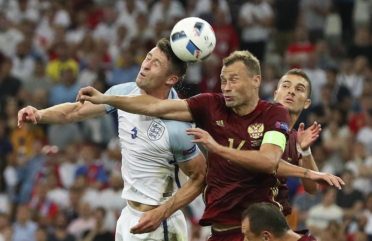 England’s Gary Cahill, left, and Russia’s Vasili Berezutski vie for the ball during the Euro 2016 Group B soccer match between England and Russia, at the Velodrome stadium in Marseille, France, Saturday, June 11, 2016. (AP Photo/Thanassis Stavrakis)