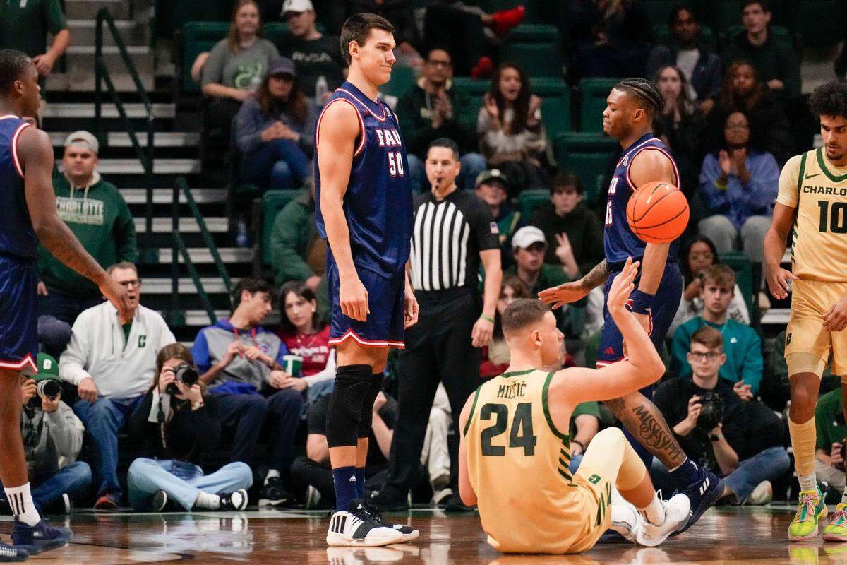 Charlotte 49ers forward Igor Milicic Jr. (24) after fouling Florida Atlantic Owls center Vladislav Goldin (50) during the second half on Jan. 6 at Dale F. Halton Arena.