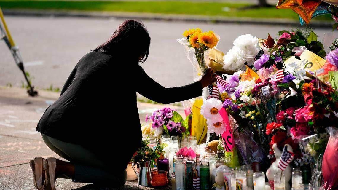 Shannon Waedell-Collins pays her respects at the scene of the May 14, 2022 mass shooting that left 10 people dead and three injured at a Buffalo, N.Y. supermarket. Eleven of the 13 victims were Black.