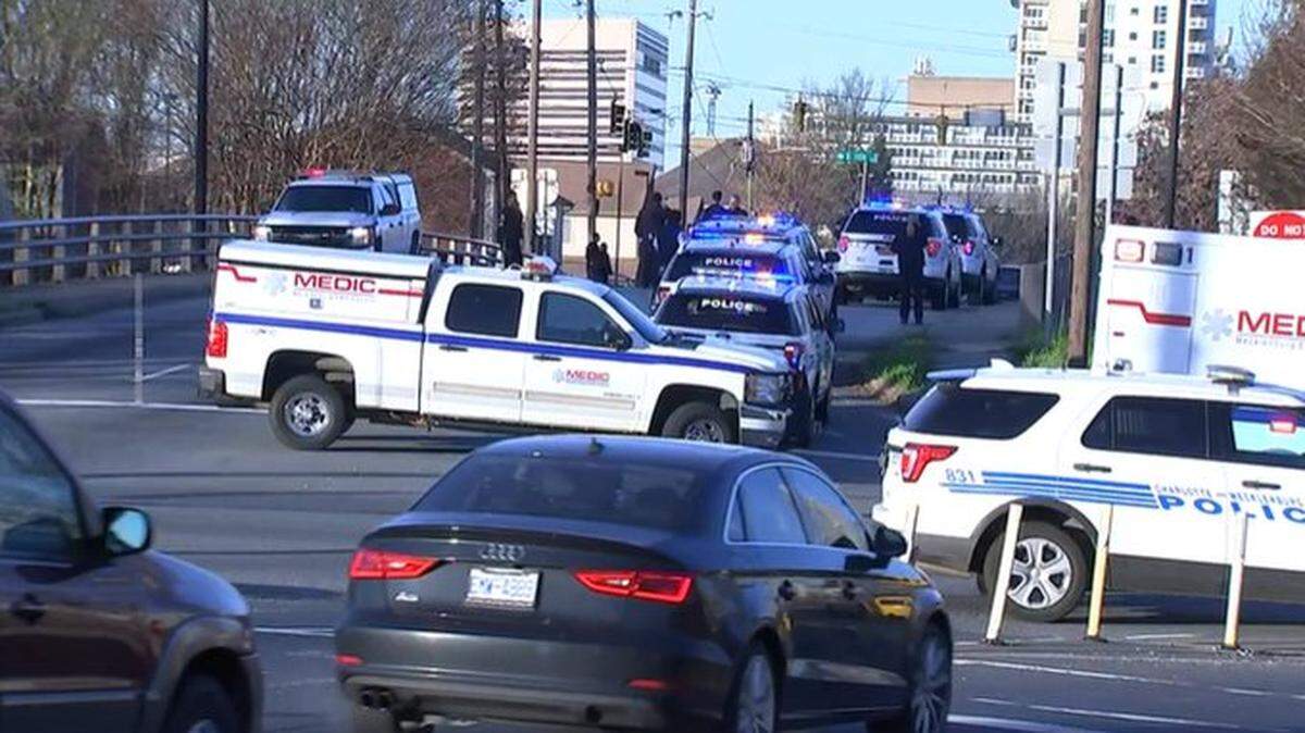 Police and Medic vehicles at the scene of an emergency along Interstate 77 in uptown Charlotte on Friday, March 25, 2022.