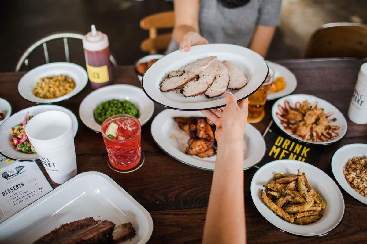 Enjoy a family meal with Southern selections from Noble Smoke. 