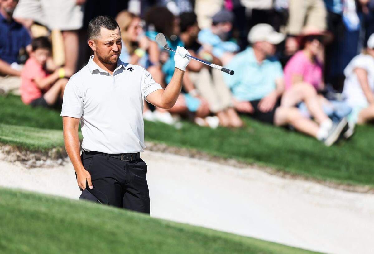 Xander Schauffele gets ready to hit from a bunker on the 15th hole during round three of the Wells Fargo Championship at Quail Hollow Club in Charlotte, N.C., on Saturday, May 11, 2024.