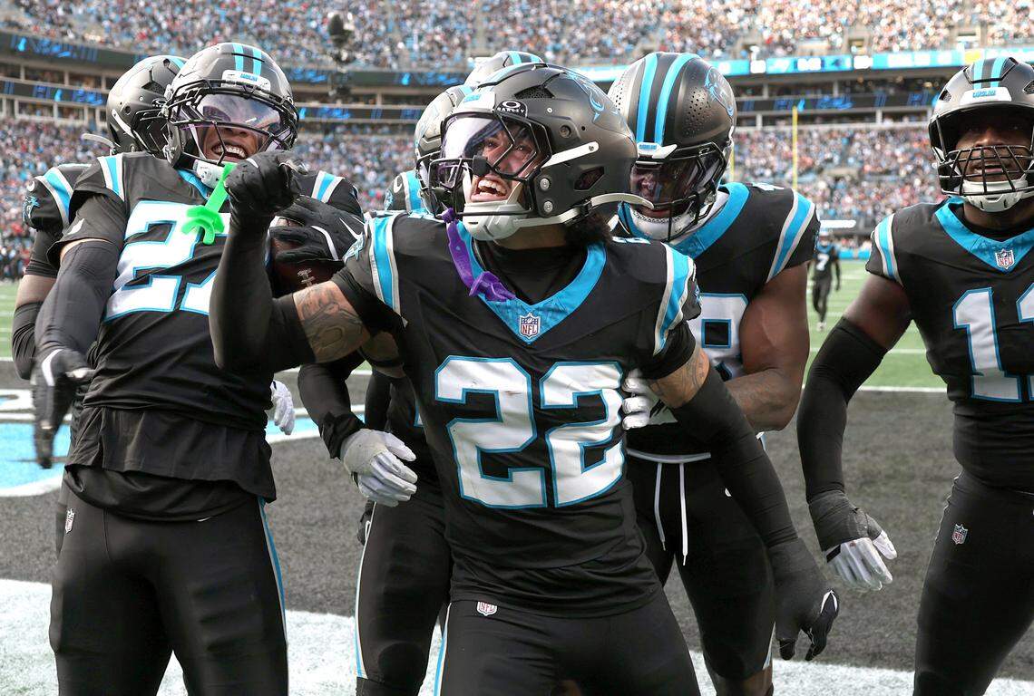 Carolina Panthers safety Lathan Ransom, center, celebrates his interception of a pass by Tampa Bay Buccaneers quarterback Baker Mayfield with his teammates on Sunday, Dec. 21, 2025 at Bank of America Stadium in Charlotte, North Carolina. The Panthers defeated the Buccaneers 23-20.