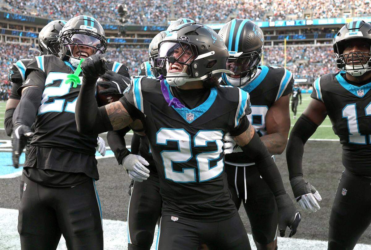 Carolina Panthers safety Lathan Ransom, center, celebrates his interception of a pass by Tampa Bay Buccaneers quarterback Baker Mayfield with his teammates on Sunday, December 21, 2025 at Bank of America Stadium in Charlotte, NC. The Panthers defeated the Buccaneers 23-20.