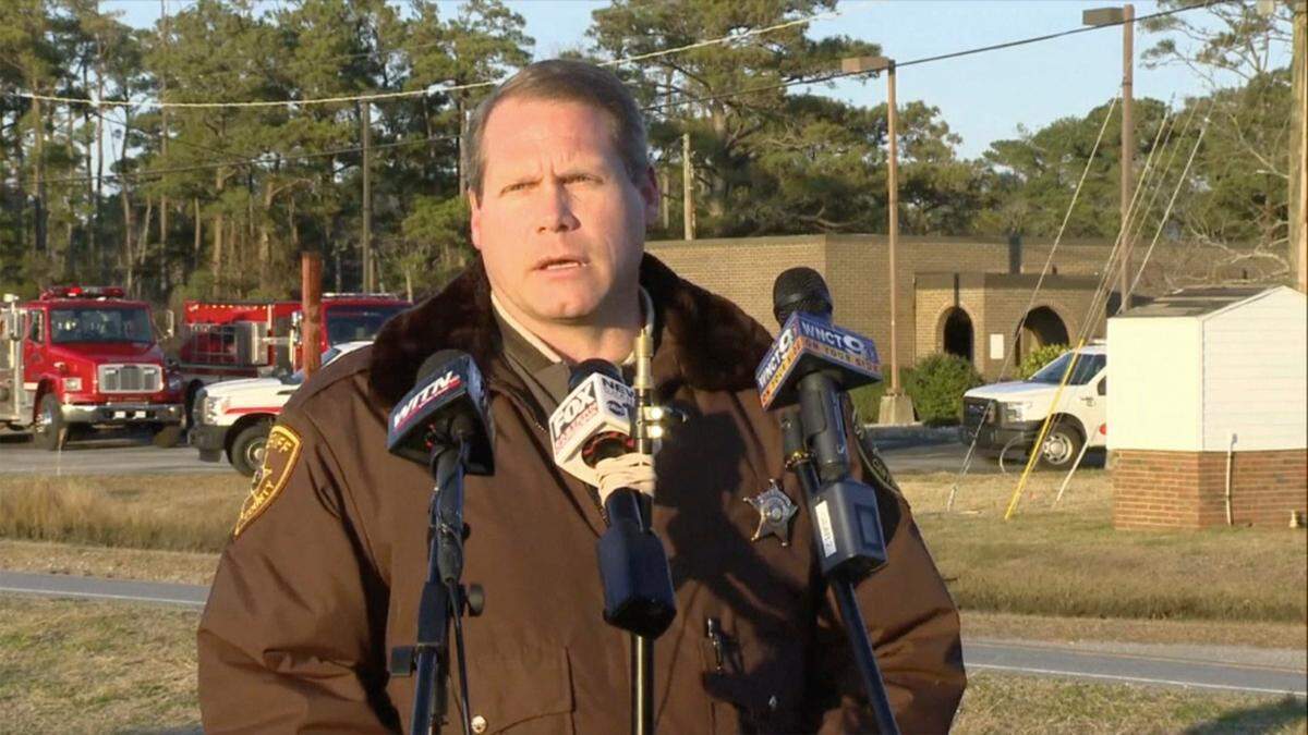 Carteret County Sheriff Asa Buck speaks with reporters in Carteret County in February. Authorities say four teenagers and four adults returning from a hunting trip were on board a small plane that crashed off the coast of North Carolina over the weekend.