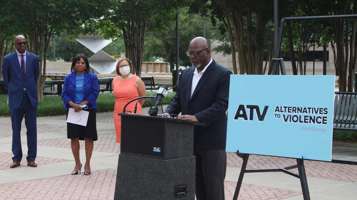 George Dunlap, chair of the Mecklenburg County Board of Commissioners, discusses the newly named violence interrupter program Alternatives to Violence on Tuesday, May 25, 2021, in front of the Charlotte-Mecklenburg County Government Center.