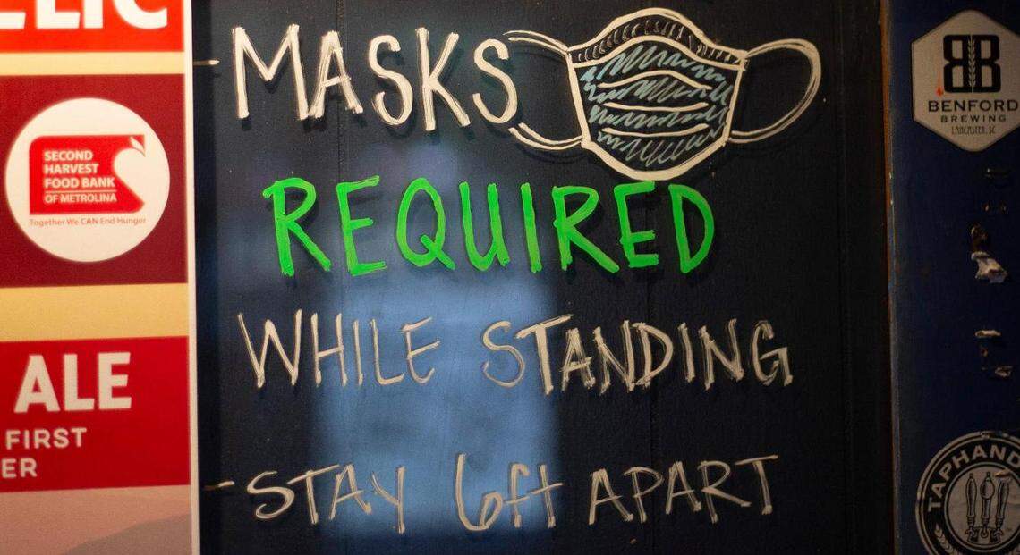 Mask signage is posted at Hattie’s Tap & Tavern.