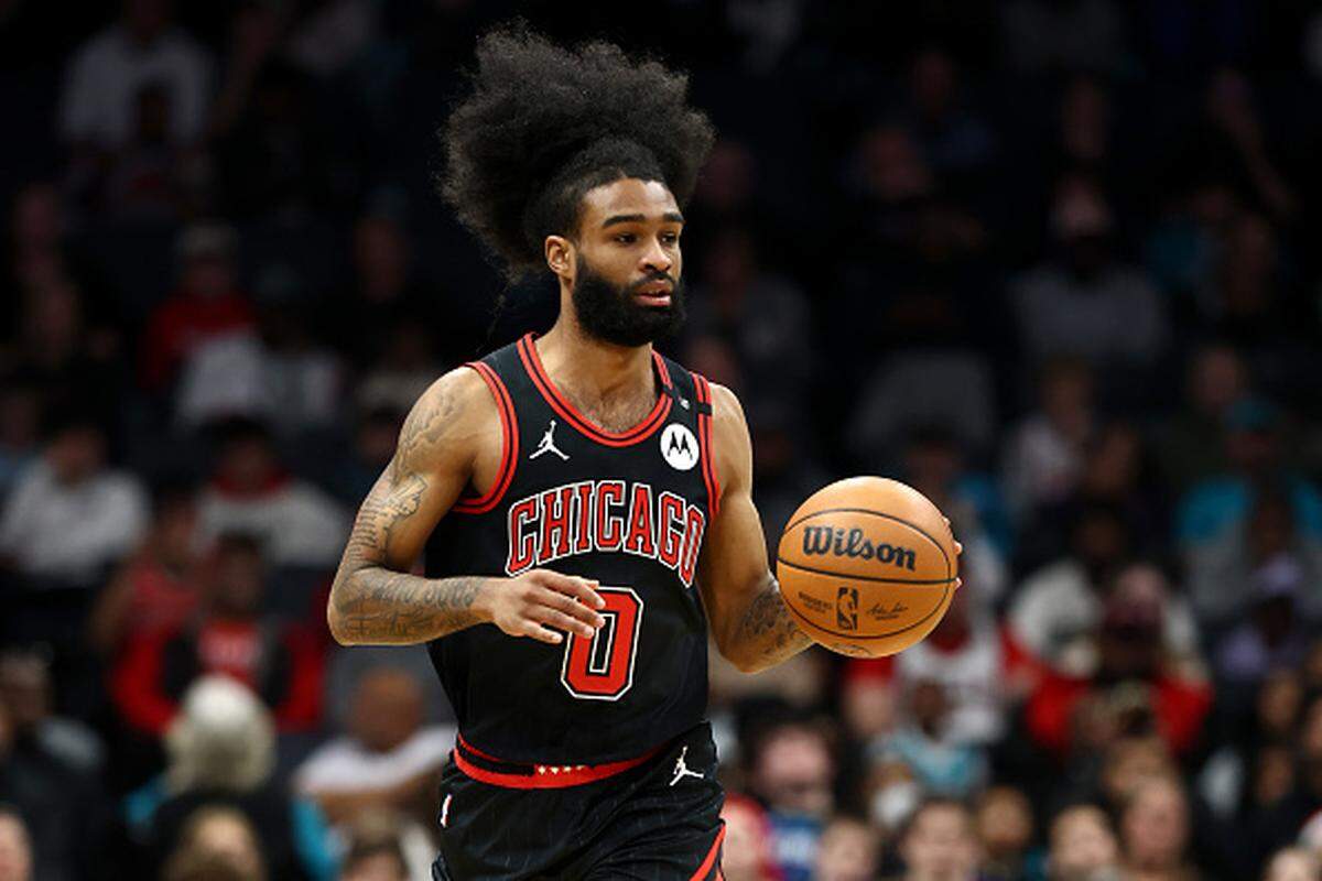 Coby White brings the ball up court during the first half of the game against the Charlotte Hornets at Spectrum Center.
