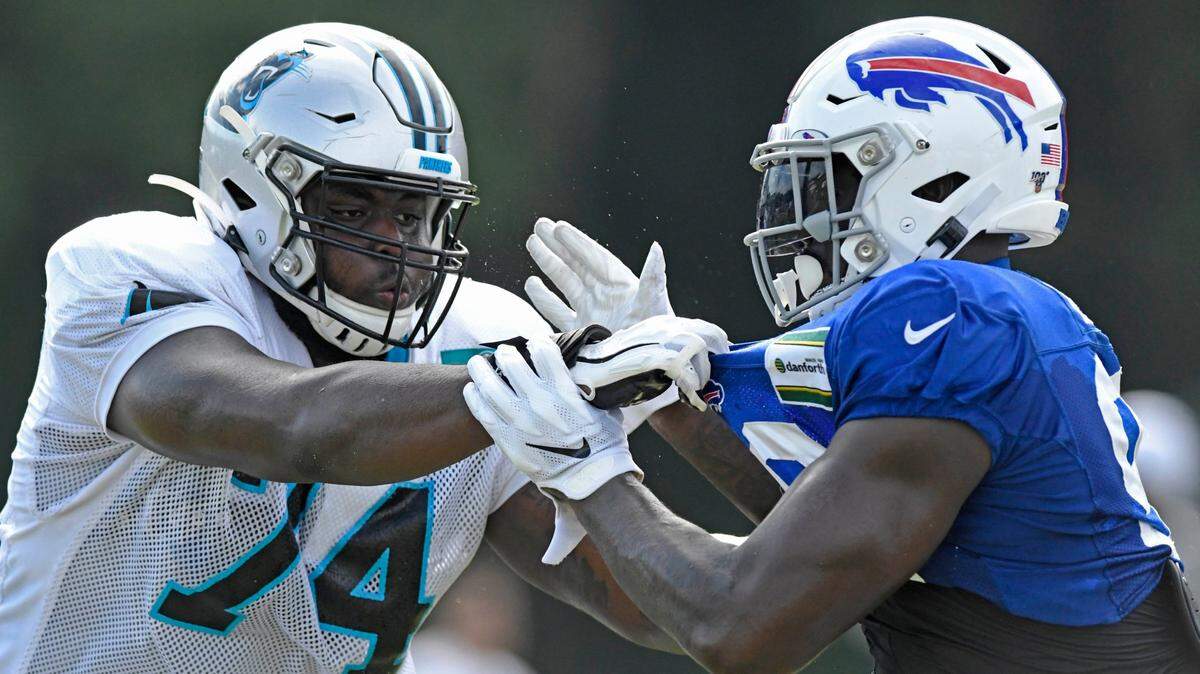Carolina Panthers offensive tackle Greg Little (74), left, was traded to the Miami Dolphins on Tuesday. The Panthers moved up in the 2019 draft to get him.