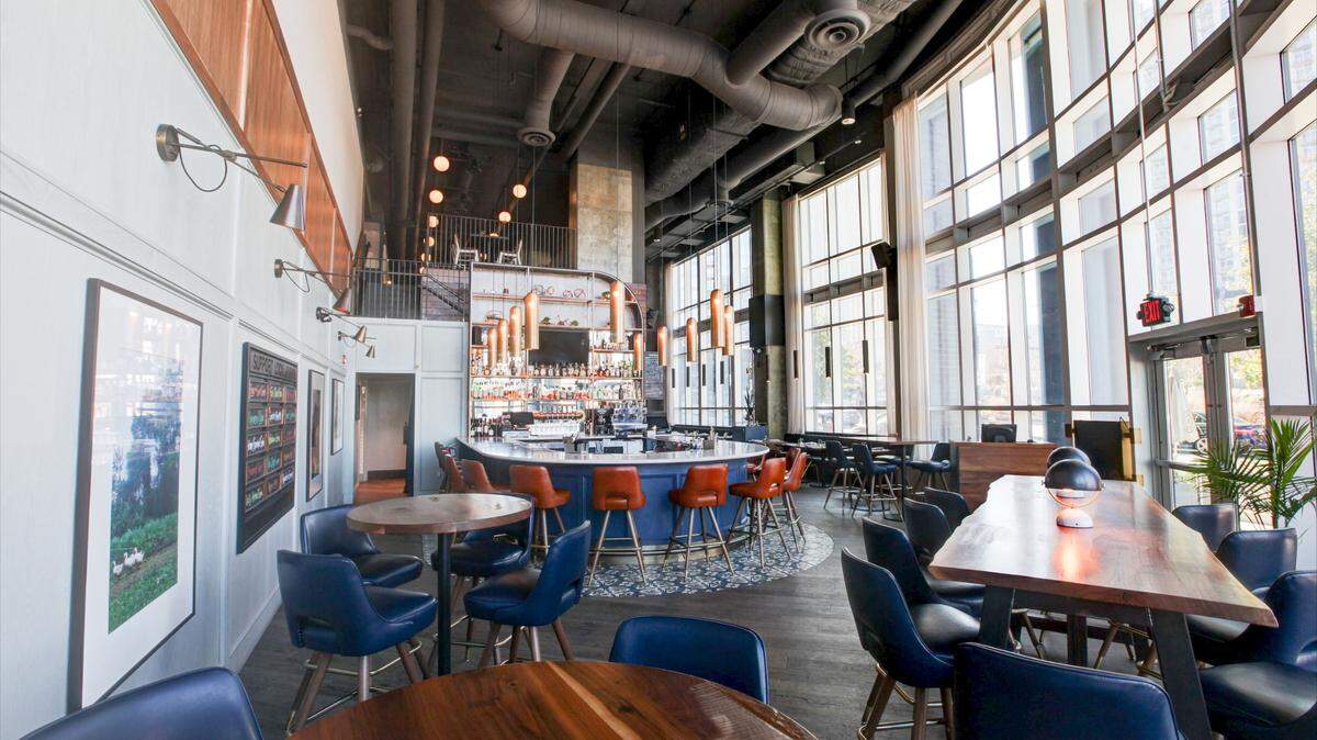 Light from floor to ceiling windows fills Haymaker’s dining room, which is closing on New Year’s Eve.