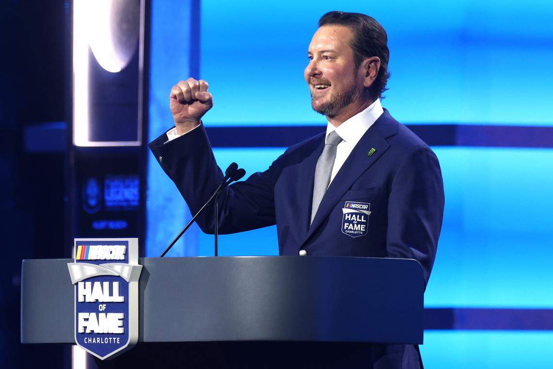 Former NASCAR driver Kurt Busch smiles as he calls mentions a group of friends during his NASCAR Hall of Fame Induction speech at the Charlotte Convention Center in Charlotte, NC on Friday, January 23, 2026. 