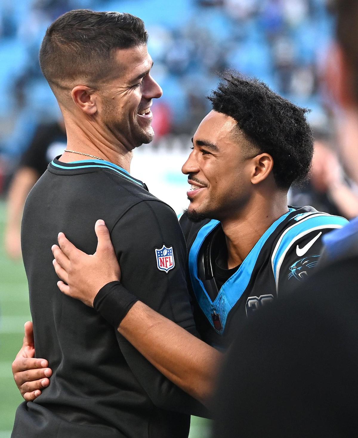 Carolina Panthers head coach Dave Canales, left, and quarterback Bryce Young, right, hug following the team’s 23-22 victory over the New Orleans Saints at Bank of America Stadium in Charlotte, NC on Sunday, November 3, 2024.