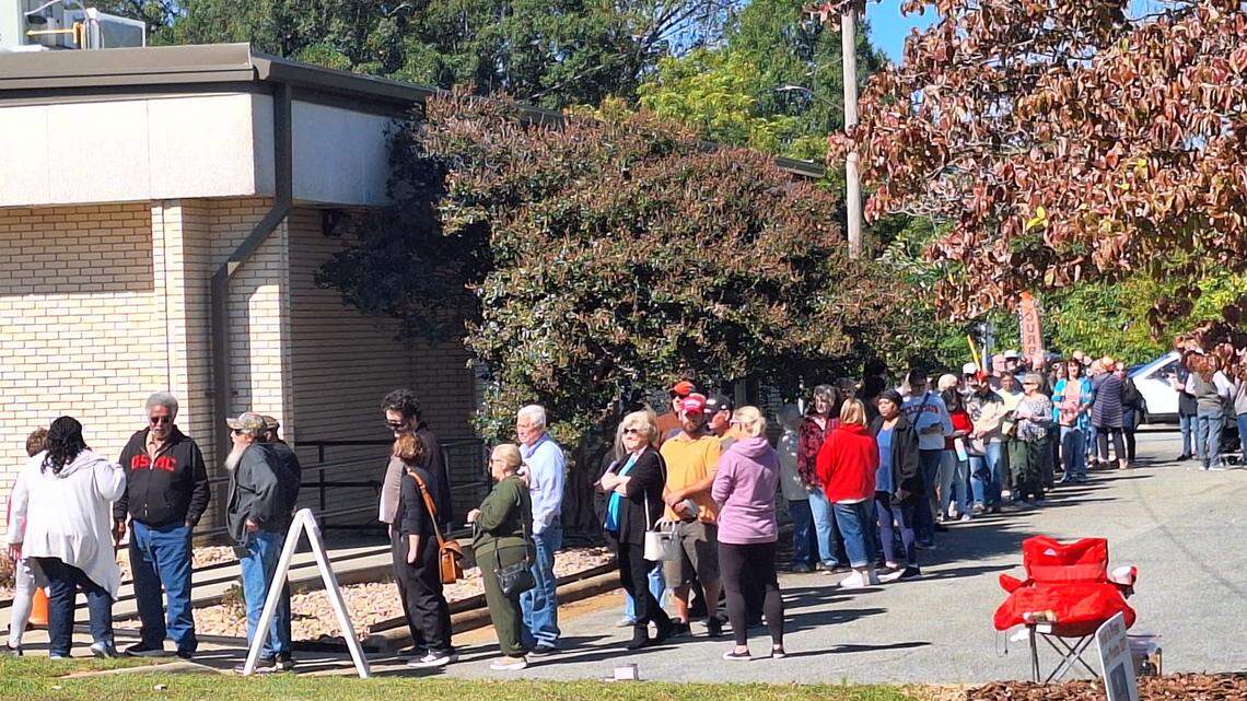 At least 200 voters were lined up outside the Iredell County Board of Elections in downtown Statesville around 12:20 p.m. Thursday on opening day of early voting.