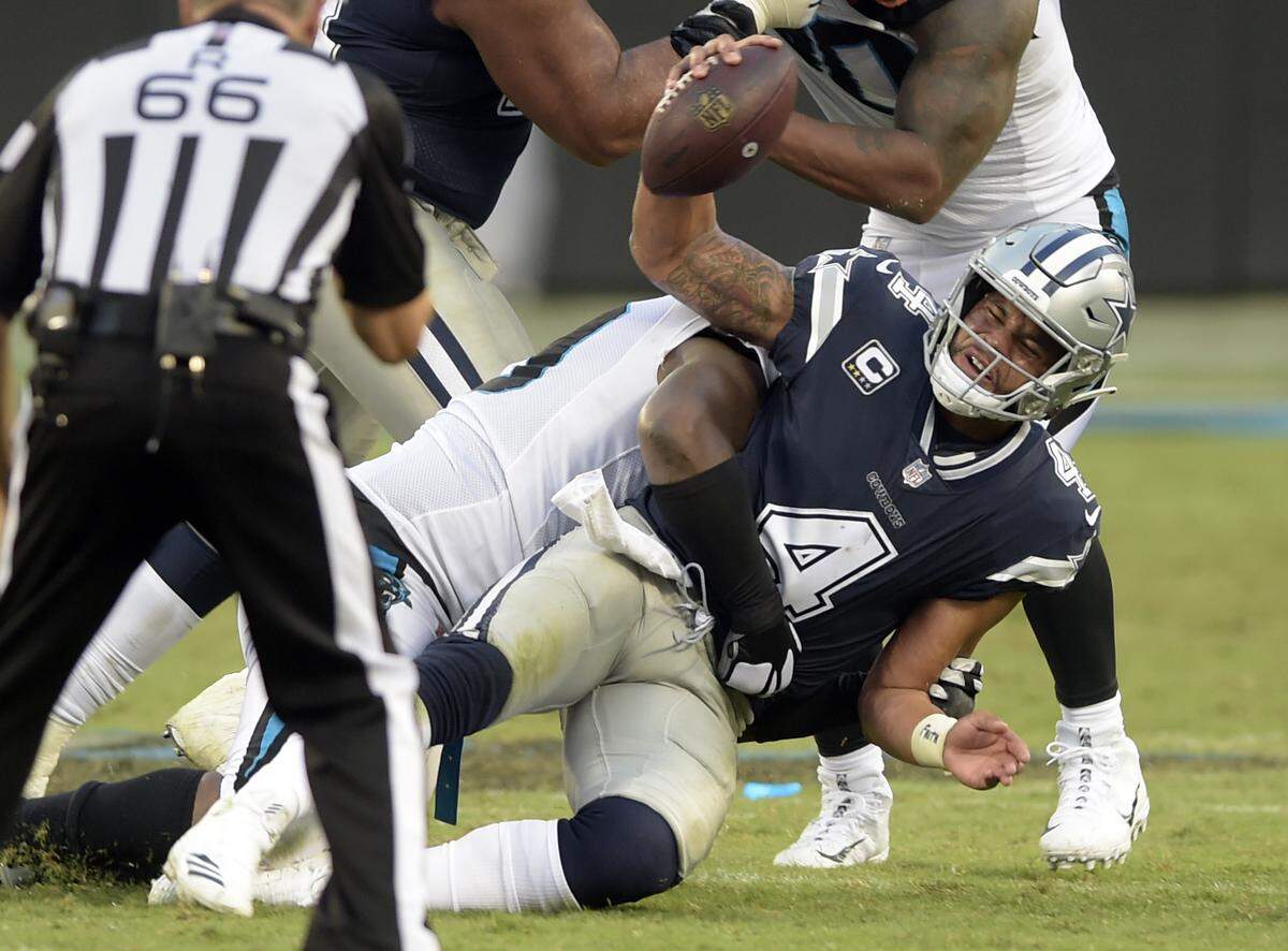 The Panthers pass-rush had six sacks on Dallas quarterback Dak Prescott, while the run defense held running back Ezekiel Elliott to just 69 yards and a touchdown. (AP Photo/Mike McCarn)