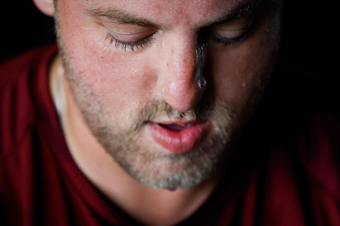 Sweat drips from the face of Justin Ashley, an American history teacher at Community House Middle School, during a workout at Round9 fitness studio in Charlotte.