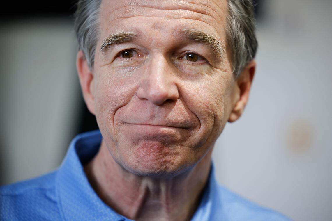 Gov. Roy Cooper speaks to the media before the Presidents Cup golf tournament at the Quail Hollow Club in Charlotte, N.C., Thursday, Sept. 22, 2022.