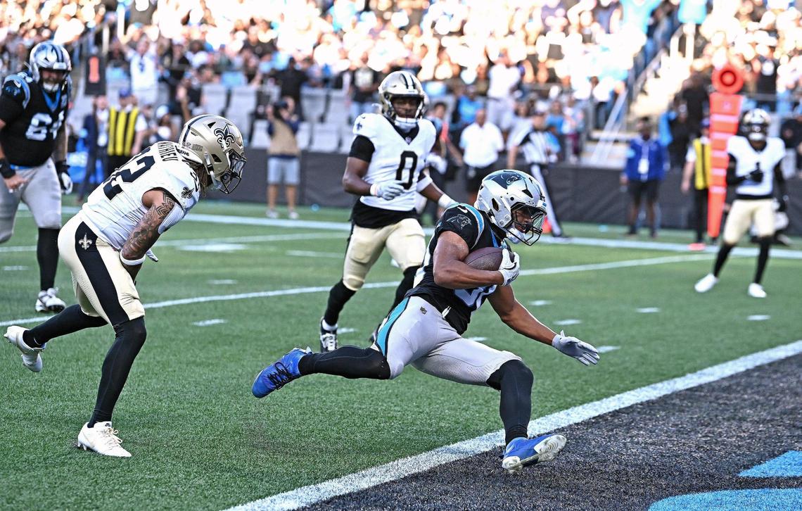 Carolina Panthers running back Chuba Hubbard, center, rushes into the end zone for a touchdown during fourth quarter action against the New Orleans Saints at Bank of America Stadium in Charlotte, NC on Sunday, November 3, 2024. The Panthers defeated the Saints 23-22.