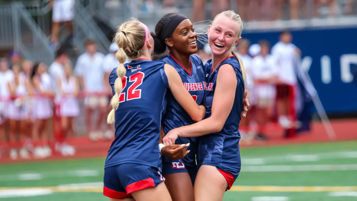 Providence day embrace in a victory hug after a hard fought game against Charlotte Latin at the NCISAA girls soccer finals at Providence Day