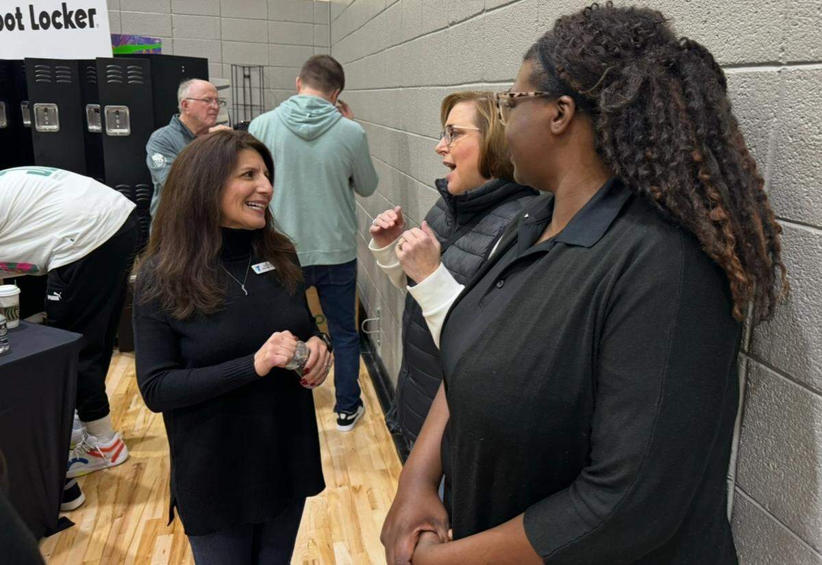 Suehila Glass speaks with YMCA staff during a community event at the Simmons YMCA, in this file photo. The YMCA of Greater Charlotte is laying off workers due to a staff realignment. It’s unclear how many workers have been impacted. 