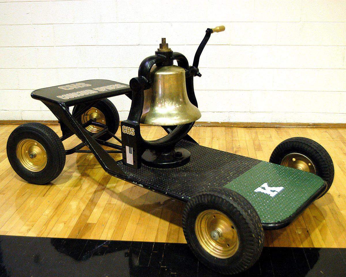 The Bell has logos of Concord High School, painted on the back, and a green with white K is for A.L. Brown, Kannapolis on the front. 