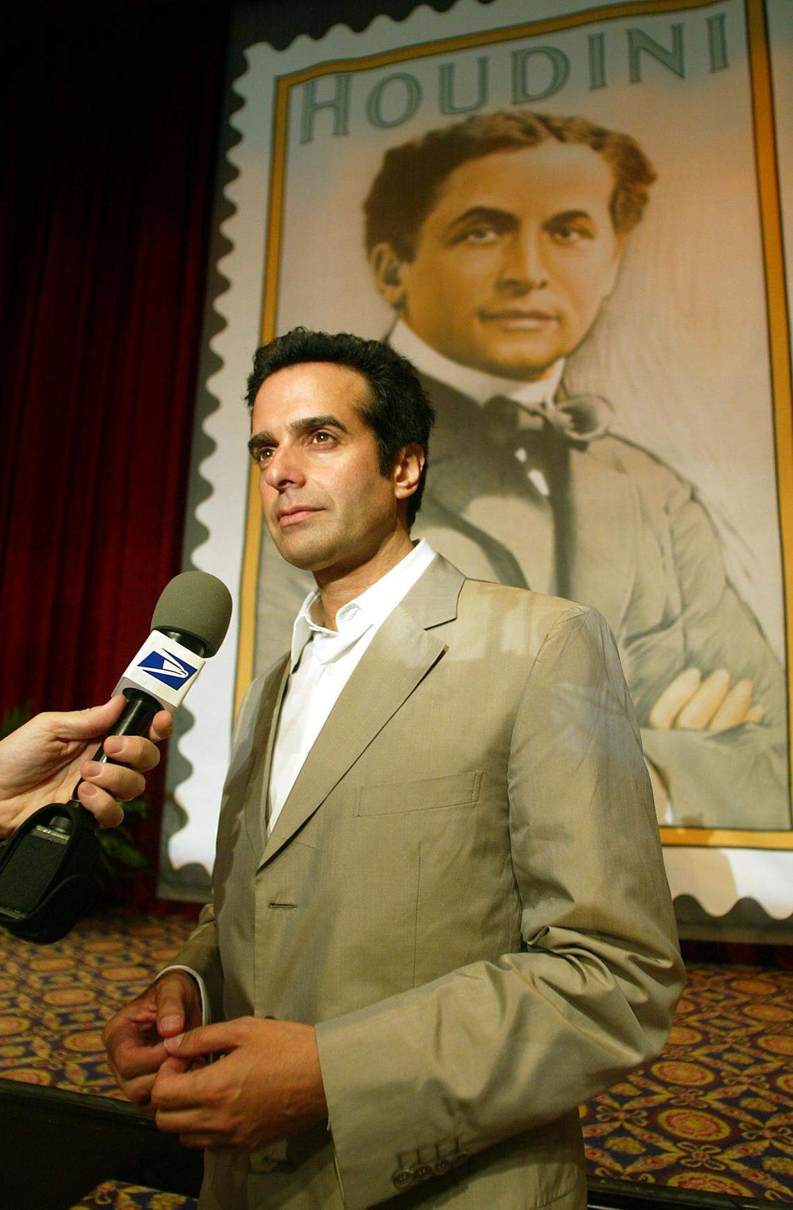 NEW YORK - JULY 3:  Magician David Copperfield attends the unveiling of the Harry Houdini 37-cent postage stamp at the Society of American Magicians Centennial Convention July 3, 2002 in New York City. The stamp was created from a 1911 lithographed poster from the collection of Gary H. Mandelblatt. (Photo by Mario Tama/Getty Images)