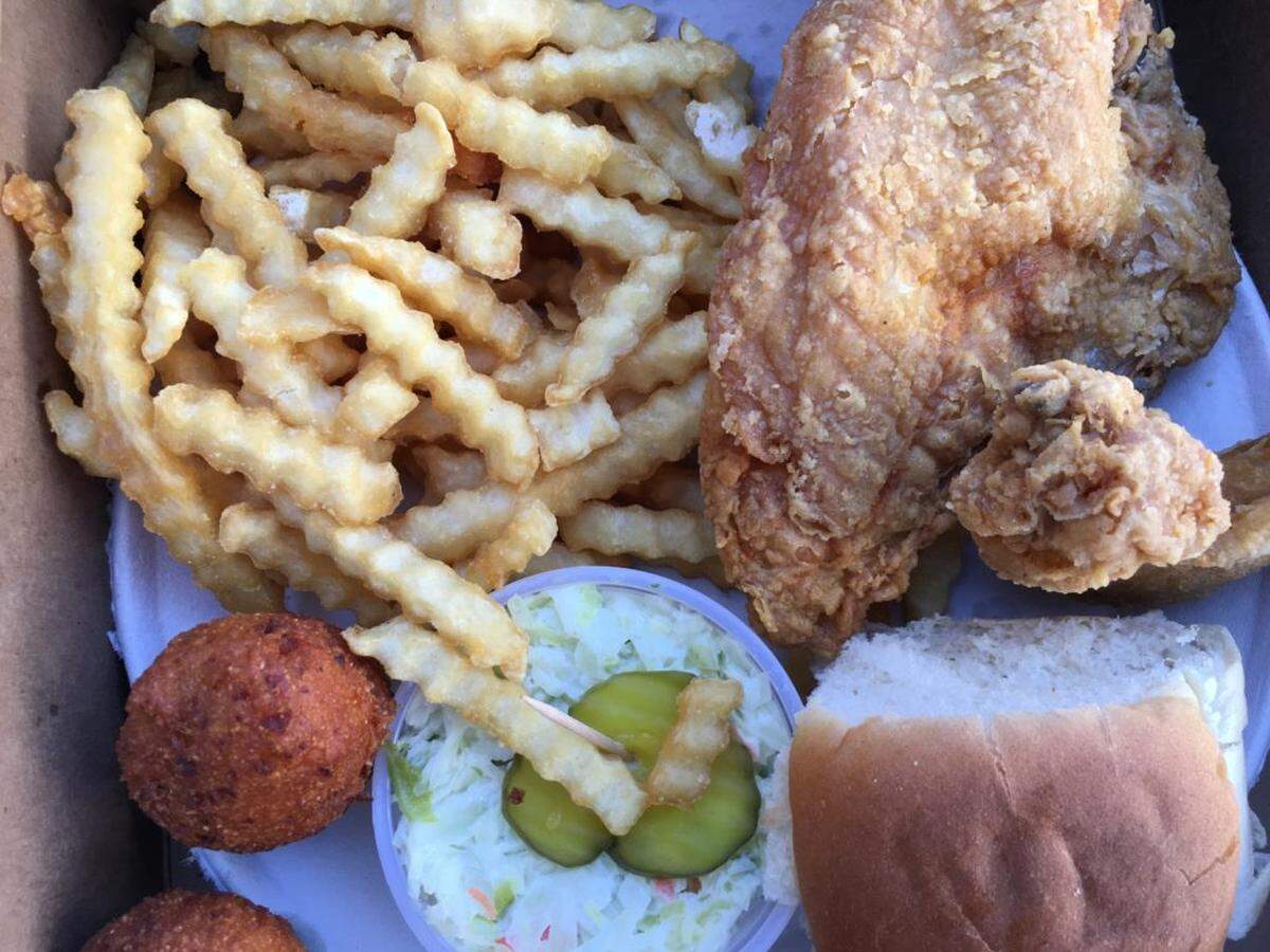 Price’s Chicken Coop’s fried chicken comes with coleslaw, fries, hushpuppies and a roll.
