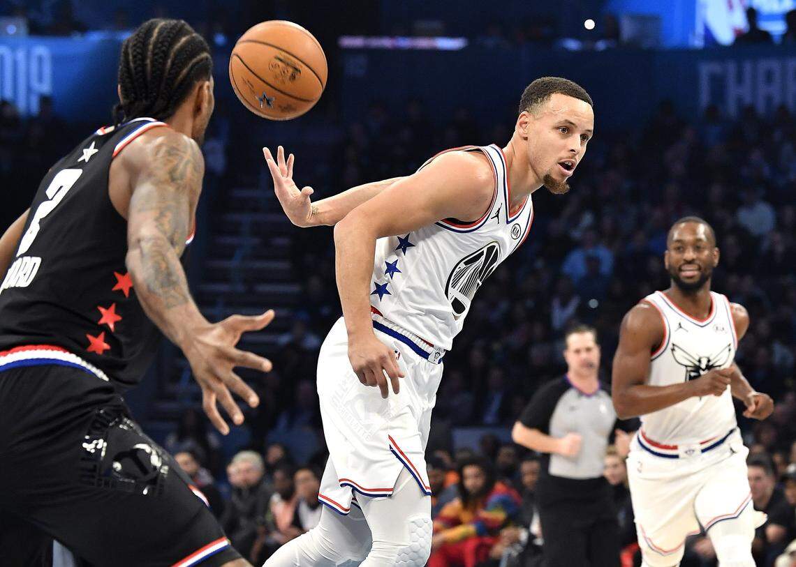 Golden State Warrior guard Stephen Curry throws a behind the back pass to a teammate on a fast break during the NBA All-Star Game at Spectrum Center in Charlotte, NC on Sunday, February 17, 2019.