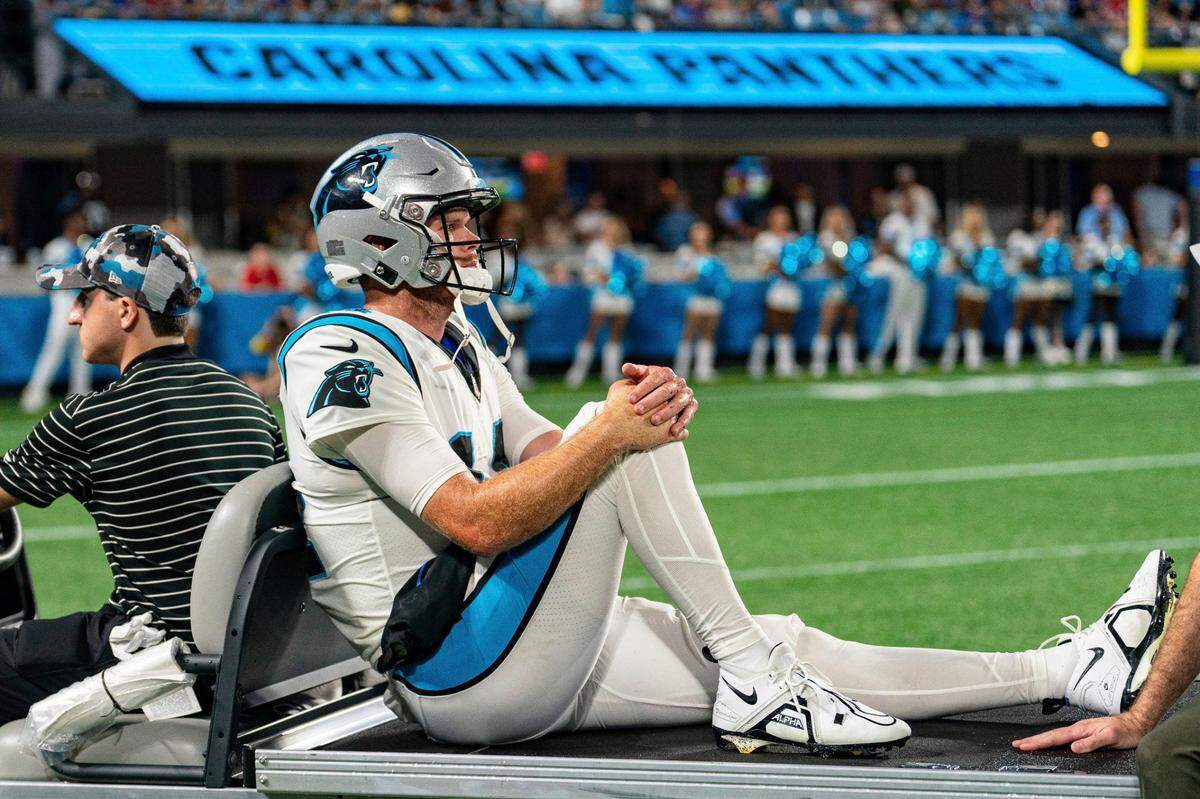 Carolina Panthers quarterback Sam Darnold (14) is carted off the field during an NFL preseason football game against the Buffalo Bills on Friday, Aug. 26, 2022, in Charlotte, N.C. Darnold suffered a high ankle sprain on the play.
