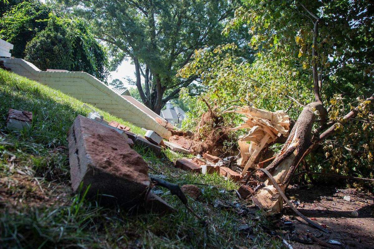 This photograph, taken in early August, shows some of the damage that resulted after a speeding car plowed into brick steps and a tree on Colville Road in Charlotte. Two young men died in the wreck.