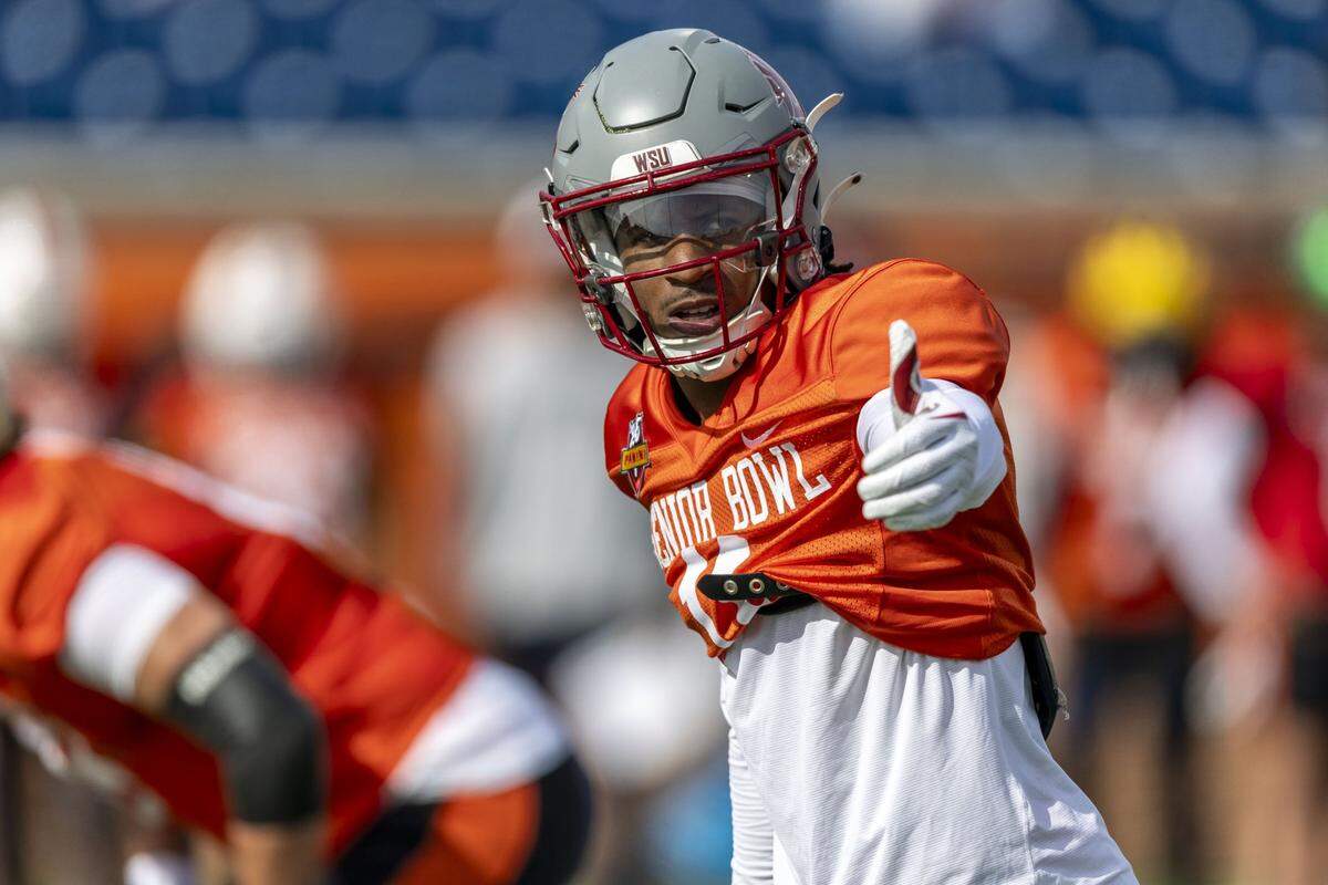 Jan 28, 2025; Mobile, AL, USA; National team wide receiver Kyle Williams of Washington State (11) sets up at the line during Senior Bowl practice for the National team at Hancock Whitney Stadium. Mandatory Credit: Vasha Hunt-Imagn Images