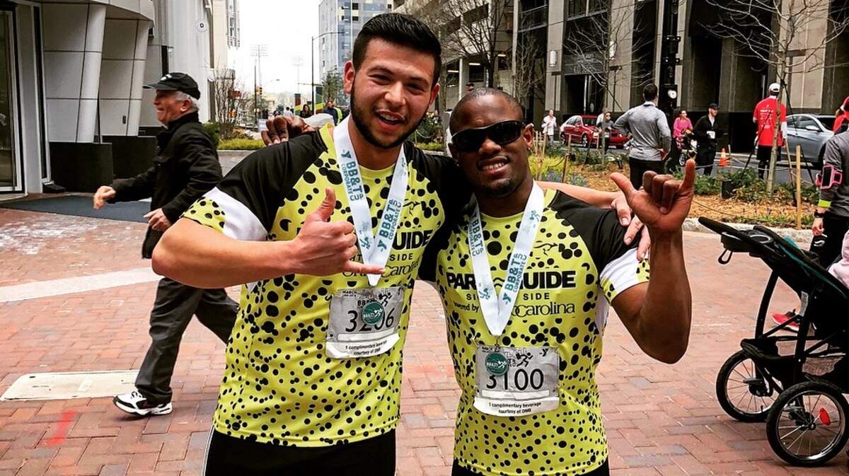 When Davian Robinson, right, helped Jordan Scott reach his lifelong dream of running a 5K, it was just the beginning of the challenges the two would take on together.