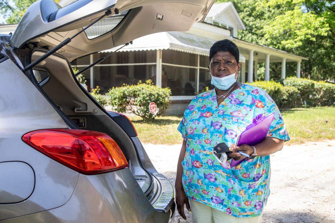 CNA Venice Sanders worked in nursing homes until last year. Since then she has opted for the less stressful work of caring for elderly residents inside their homes.