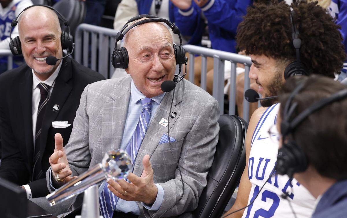 Dick Vitale talks with Duke’s Cameron Boozer after Duke’s 75-60 victory over Texas in the Dick Vitale Invitational on Tuesday at the Spectrum Center in Charlotte.
