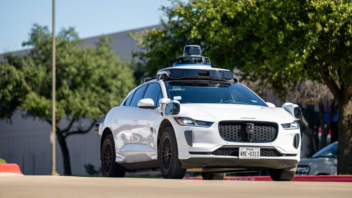 AUSTIN, TEXAS - JANUARY 15: A Waymo vehicle exits a charging lot on January 15, 2026 in Austin, Texas. Waymo is now servicing 140 square miles of Austin. The expansion comes amid ongoing competition between Tesla Robotaxis. (Photo by Brandon Bell/Getty Images)