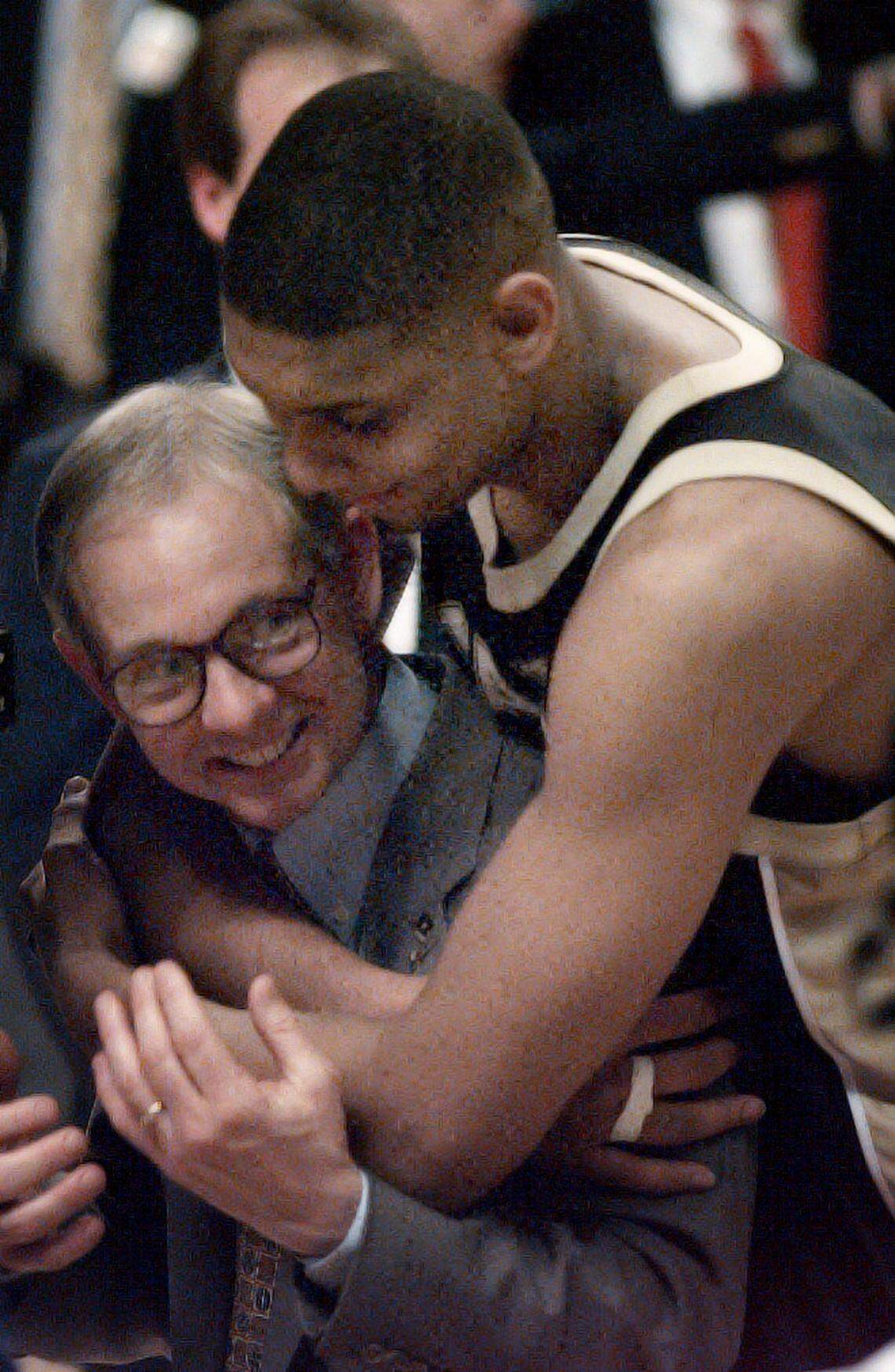 Wake Forest’s Tim Duncan hugs head coach Dave Odom after the team won their second ACC title in a row in 1996.