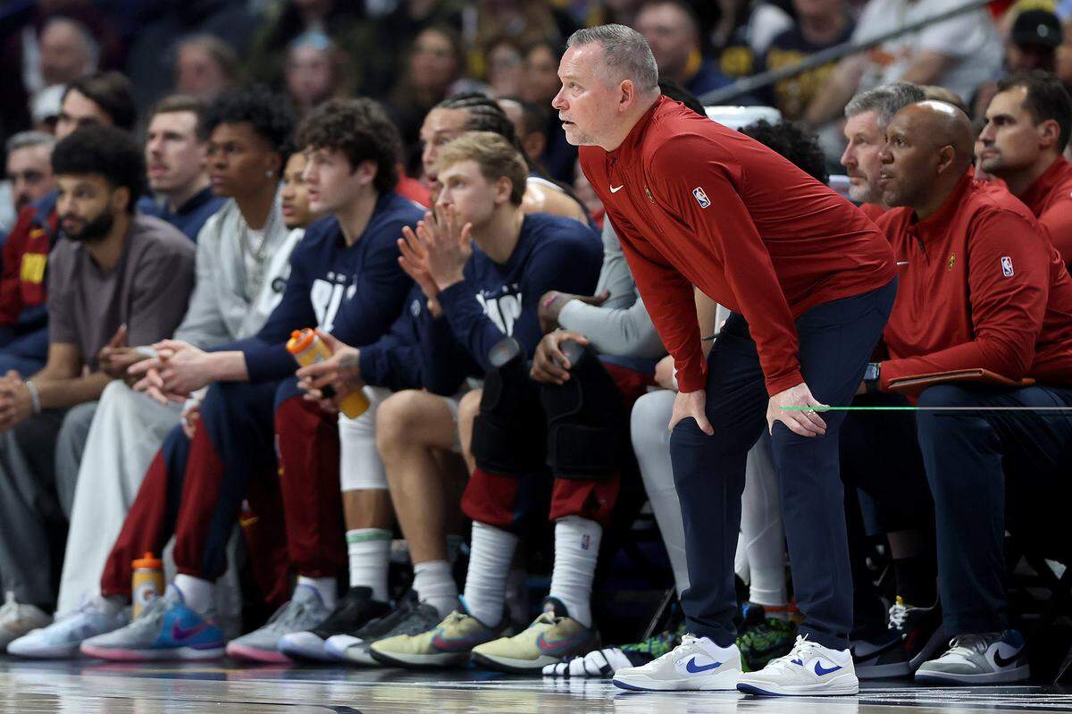 Michael Malone compiled a 510-394 record across 12 NBA seasons, holding head coaching positions with the Sacramento Kings (2013–2014) and Denver Nuggets (2015–2025). He won an NBA title with Denver in 2023.
